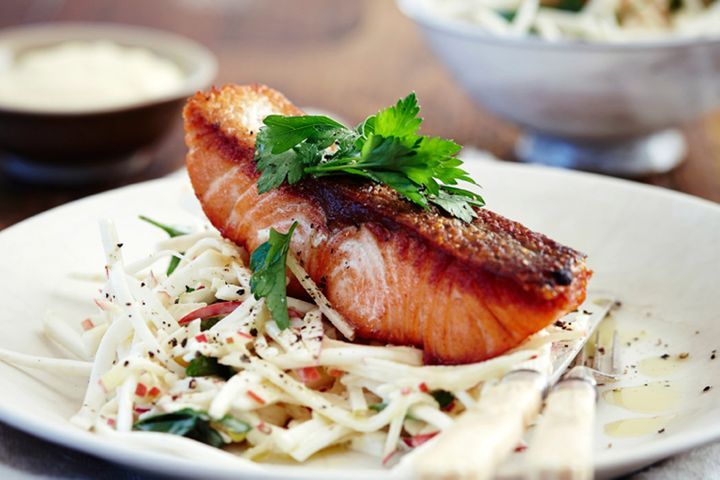 Grilled Salmon With Apple Slaw displayed on a white plate.