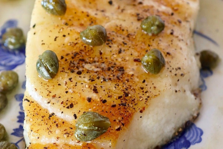 Pan Seared Glacier 51 Toothfish displayed on plate.