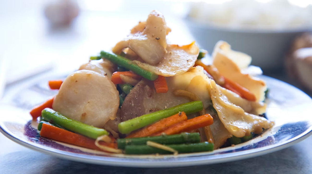 Blacklip Abalone Stir Fry on a blue plate.