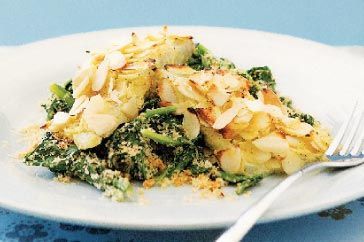 Almond Crusted Barramundi presented on white plate.