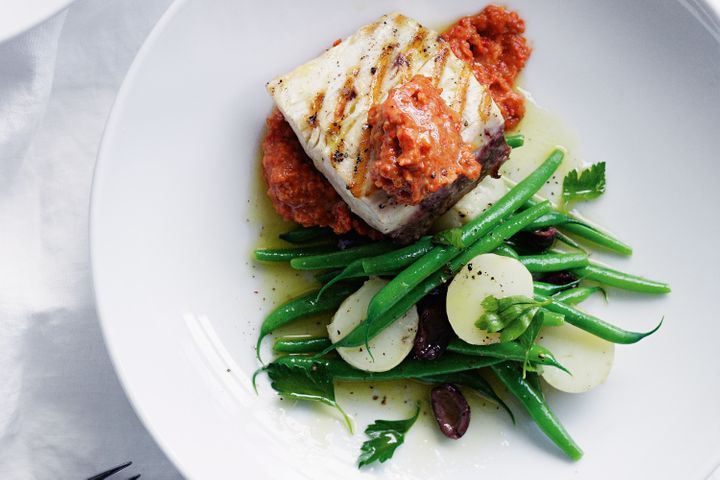Anchoiade With Kingfish on a white plate.