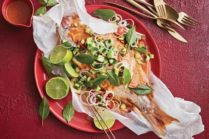 Baked Snapper Red Curry displayed on a red plate.