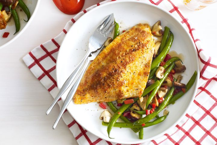 Baked Massaman Snapper on white plate.