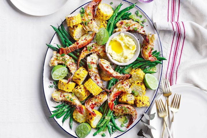 BBQ Lobster With Corn And Ginger Butter on a white platter.