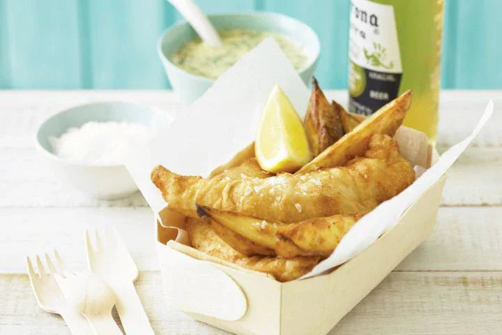 Classic Crispy Beer Battered Fish And Chips in cardboard container.