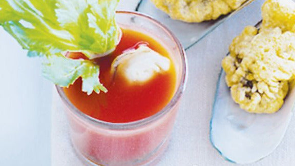Bloody Mary Oyster Shooters in a glass.