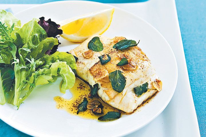 Blue Eye Cod with Lemon & Oregano presented on white plate.