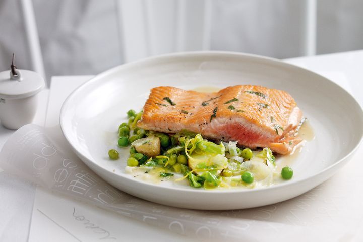 Braised Peas And Lettuce With Tarragon Ocean Trout on a plate.