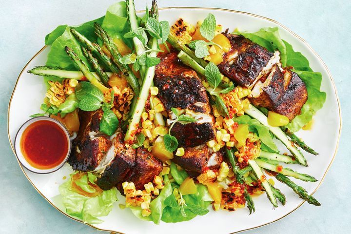 Cajun Barramundi And Corn Salad displayed on plate.