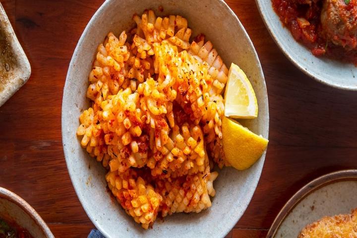 Calamari With Garlic And Chilli in a white bowl.