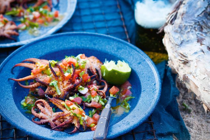 Chargrilled Baby Octopus With Pico De Gallo presented on a blue plate.