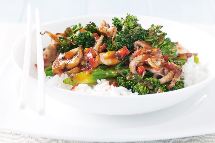 Chilli Baby Octopus Stir Fry With Broccolini in a white bowl.