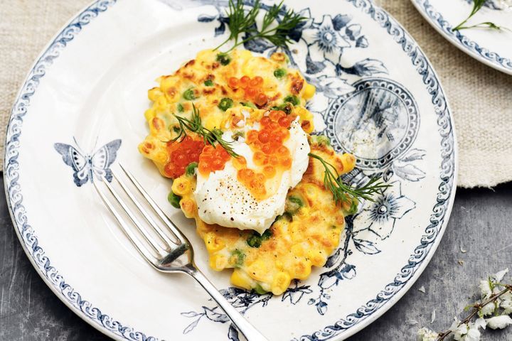 Corn And Pea Fritters With Salmon Roe displayed on plate.