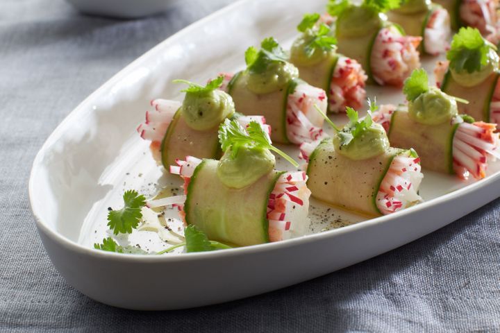 Cucumber Wrapped Snow Crab With Avocado Emulsion in serving dish.