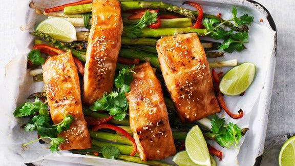Easy Asian Salmon Tray Bake presented on baking dish.