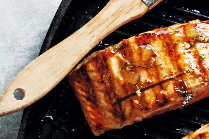 Kaffir Lime Salmon on black plate.