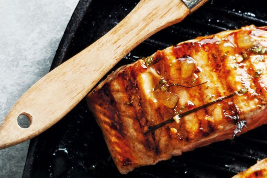 Kaffir Lime Salmon on black plate.