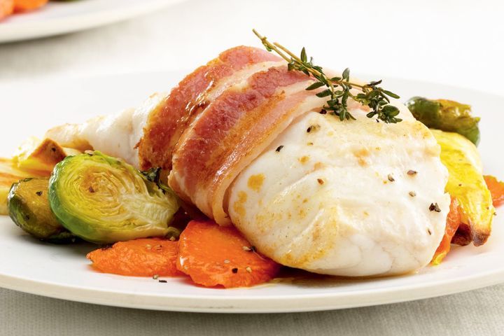 Ling Wrapped in Crispy Bacon presented on white plate.