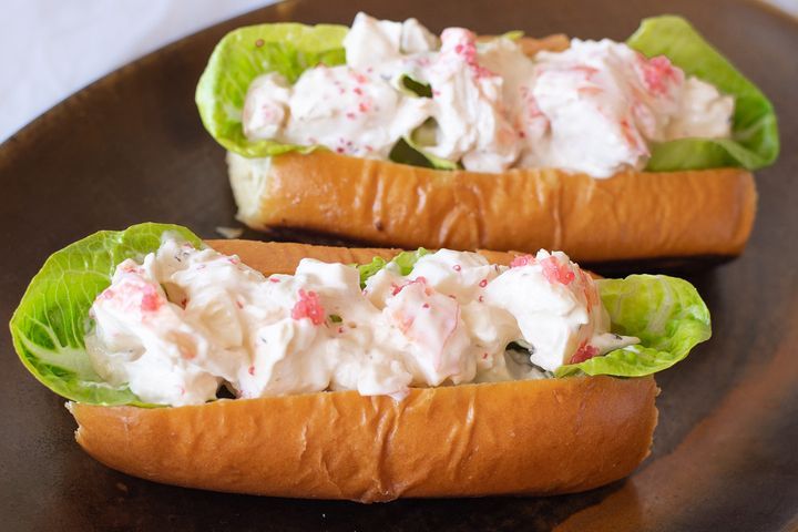 Lobster Rolls With Finger Lime Mayo presented on a brown platter.