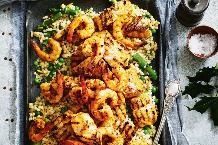 Moroccan Seafood Platter With Citrus And Mint Pearl Couscous in a tray.