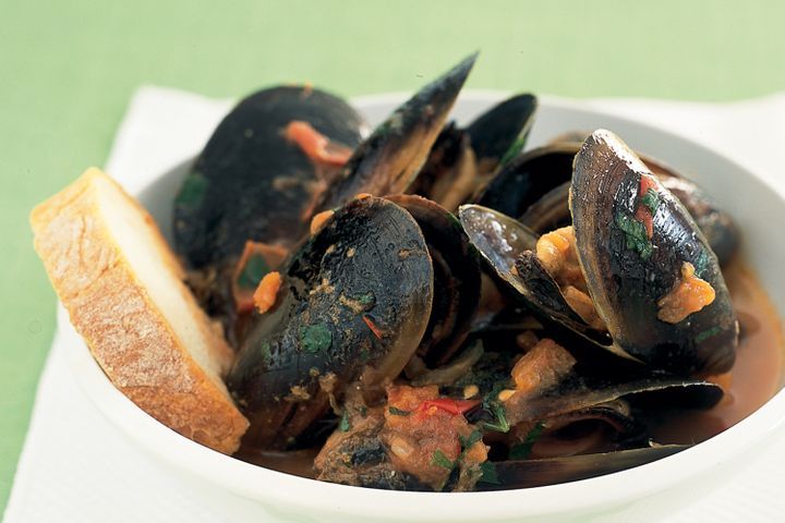 Mussels In Chilli Tomato Sauce in a bowl.