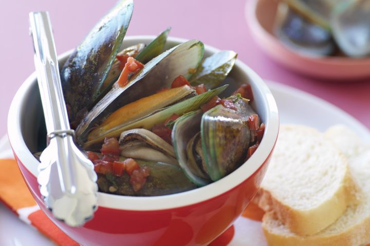 Mussels With Garlic And Wine in a red bowl.