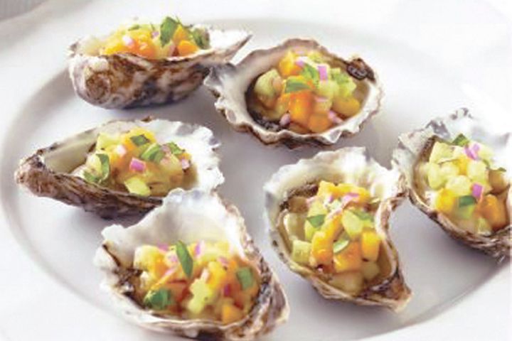 Oysters With Mango & Basil Salsa on a white plate.