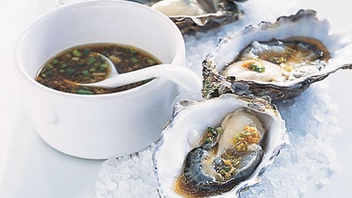 Pacific Oysters with Soy & Sesame Dressing displayed on ice.