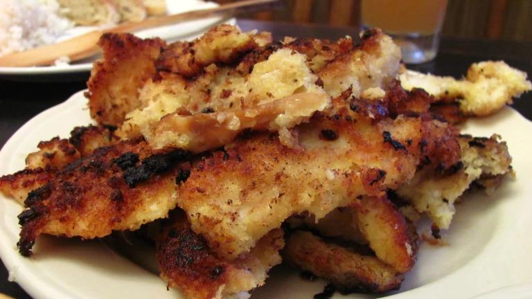 Pan Fried Abalone on a white plate.