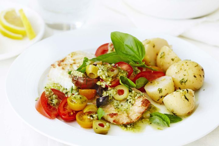 Pan Fried Ling With Tomato And Olive Salad on white plate.