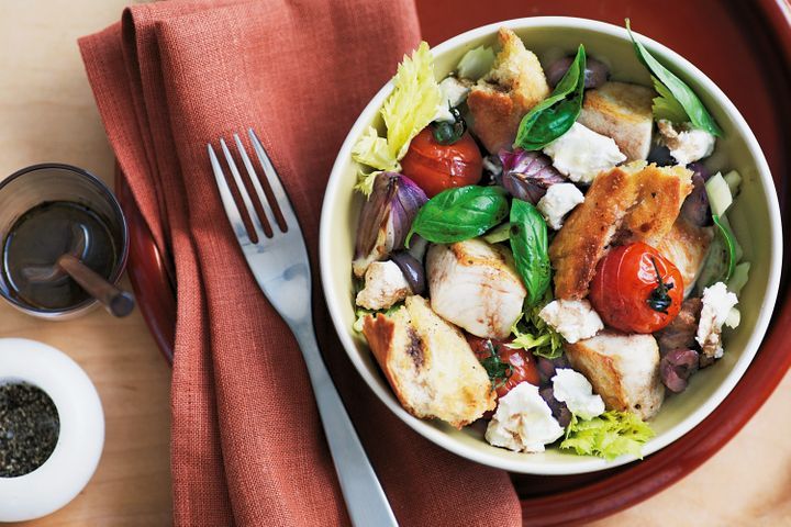 Panzanella With Kingfish And Goat's Cheese in a bowl.