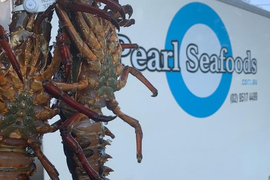 Pearl Seafoods delivery truck delivering live Eastern rock lobsters.