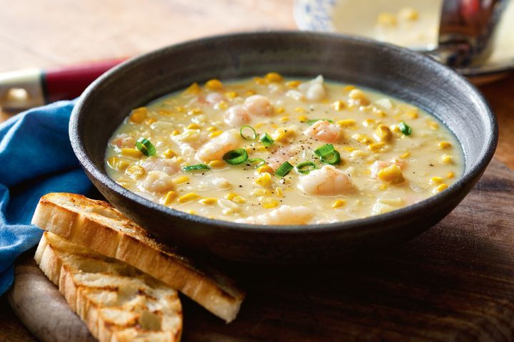 Prawn And Corn Chowder in a black bowl.