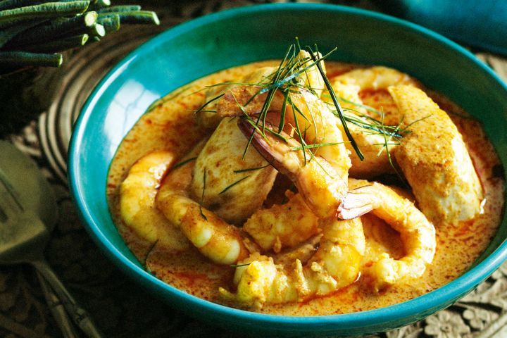 Prawn And Kingfish Choo-Chee in green bowl.