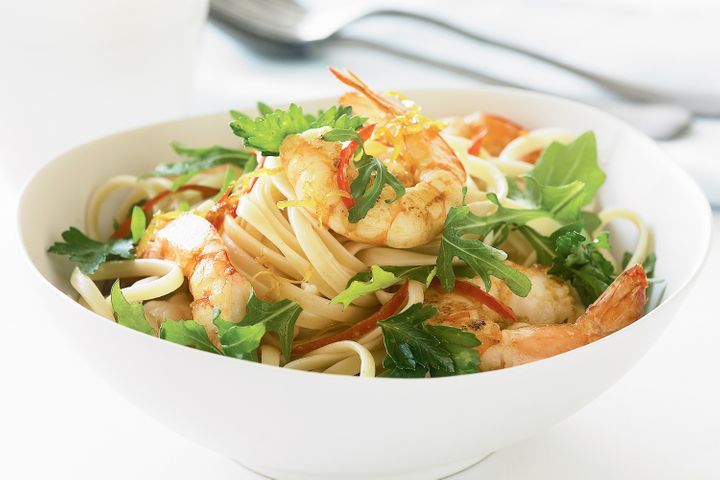 Tiger Prawn, Rocket And Chilli Linguine in a white bowl.