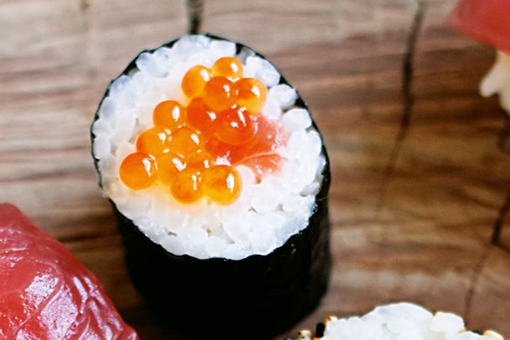 Salmon Sushi Rolls on a table.