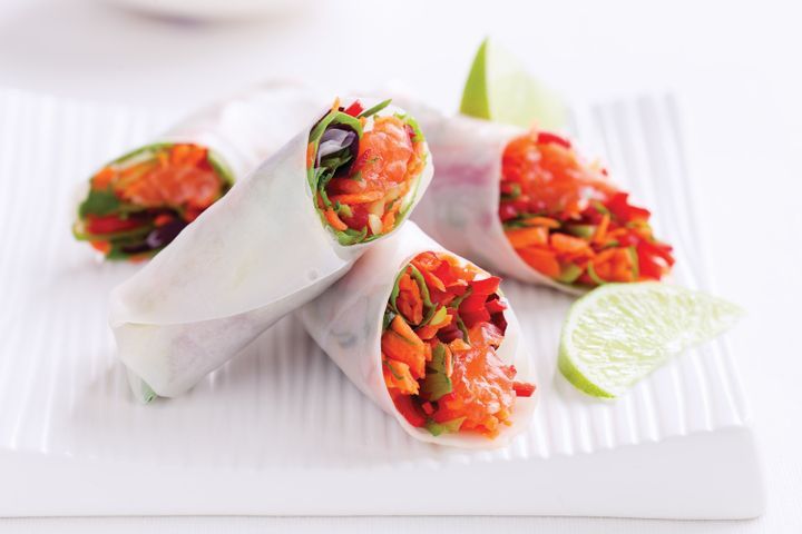 Sashimi Vegetable Rice-Paper Rolls wrapped in paper.