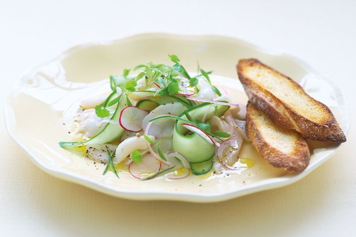 Scallop And Kingfish Ceviche on white plate.