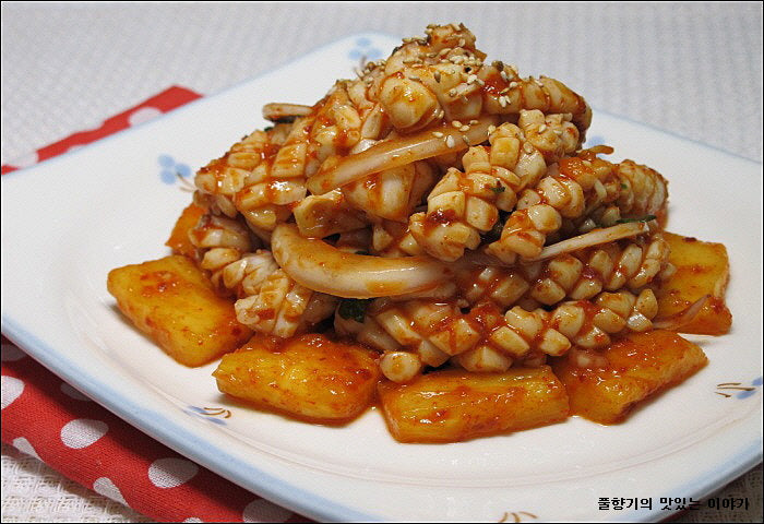 Seasoned Pineapple Squid With Vinegar on a white plate.