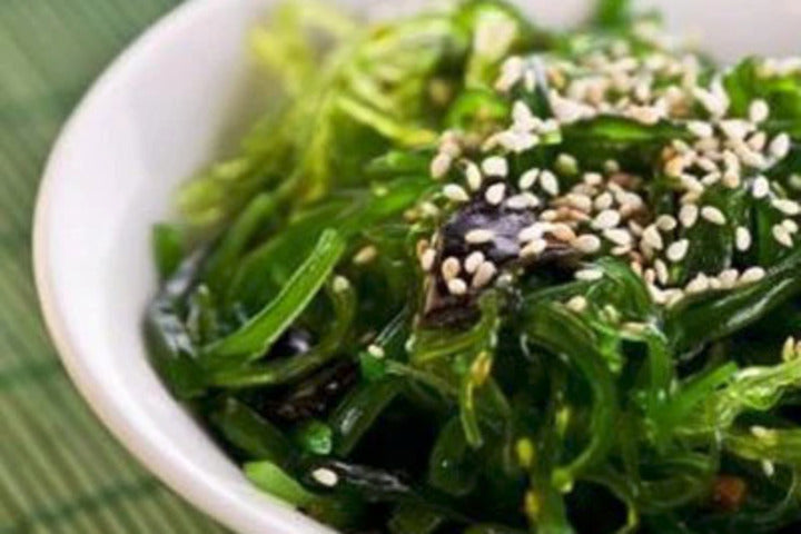 Simple Asian Seaweed Salad with Wakame in a white bowl.