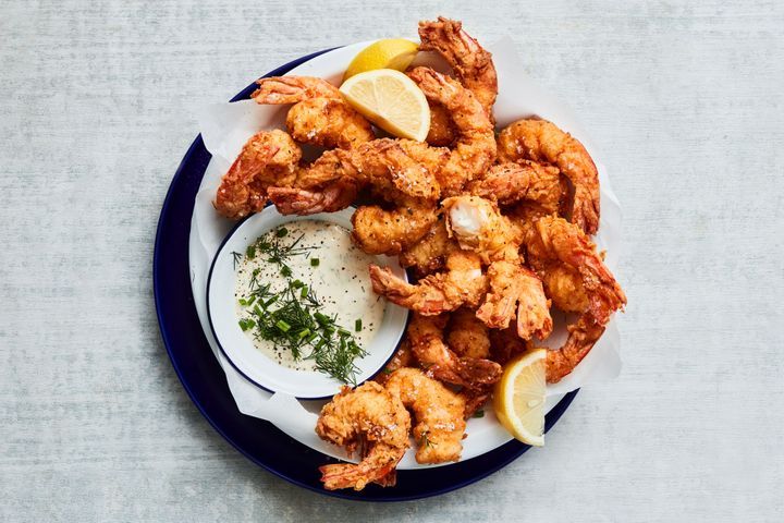 Southern Fried Prawns presented on a black plate.