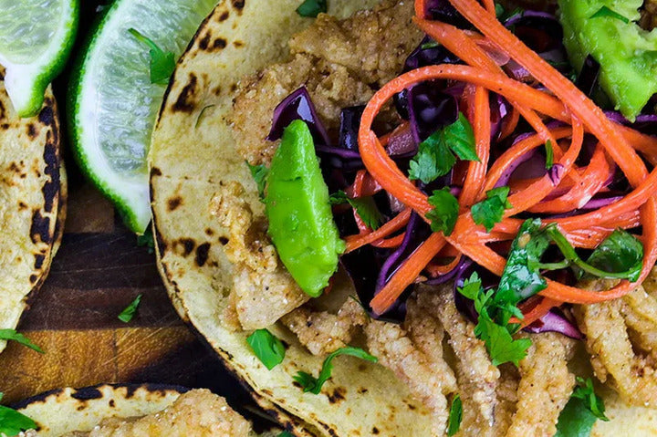 Squid Tacos with Sweet Chilli Slaw on a plate.