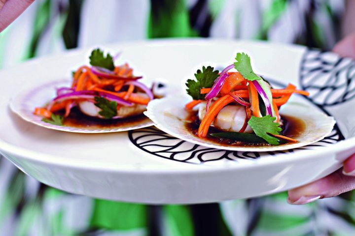 Steamed Scallops With Chinese Pickled Vegetables served on white plate.