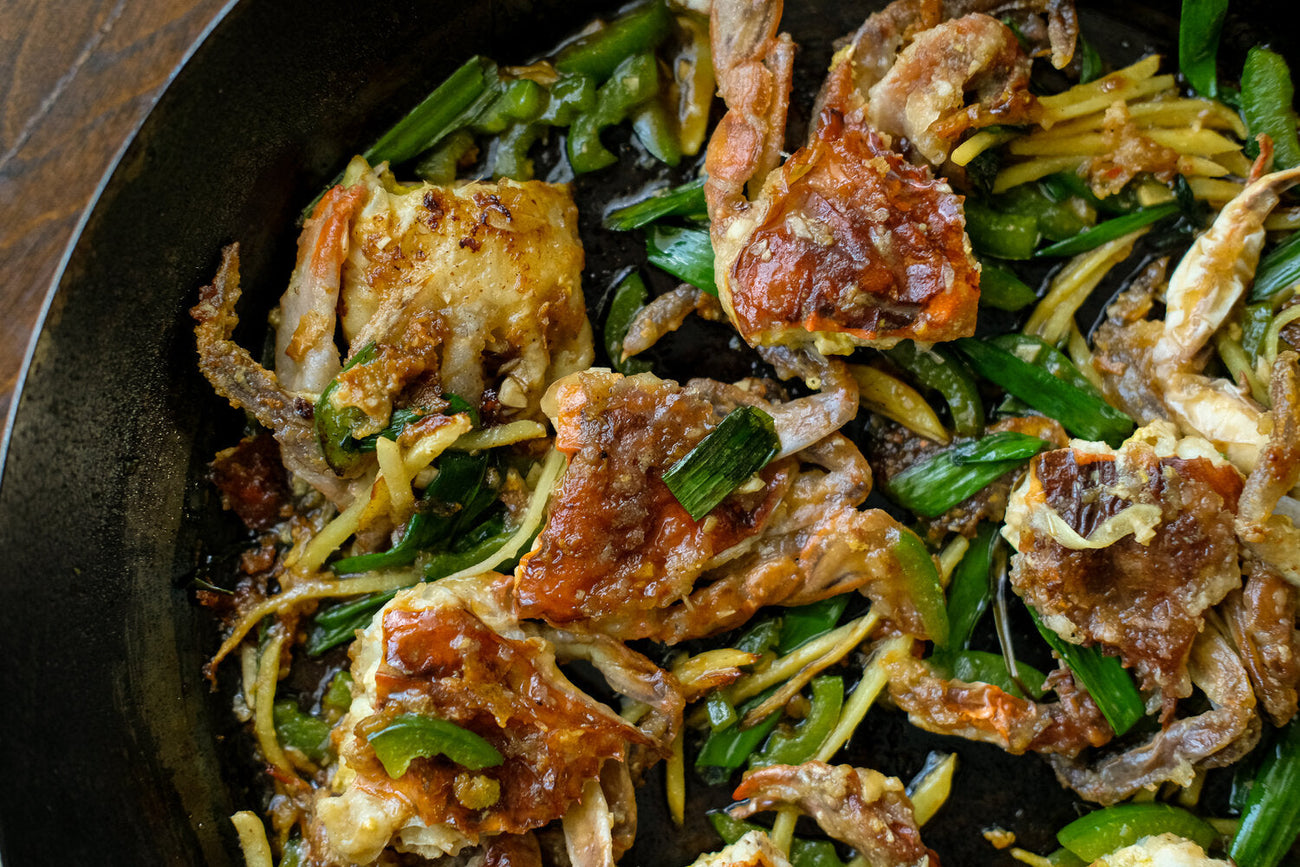 Sticky Ginger Scallion Soft Shell Crab in a pan.