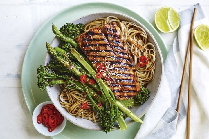 Teriyaki Barramundi With BBQ Greens And Soba Noodles on a plate.