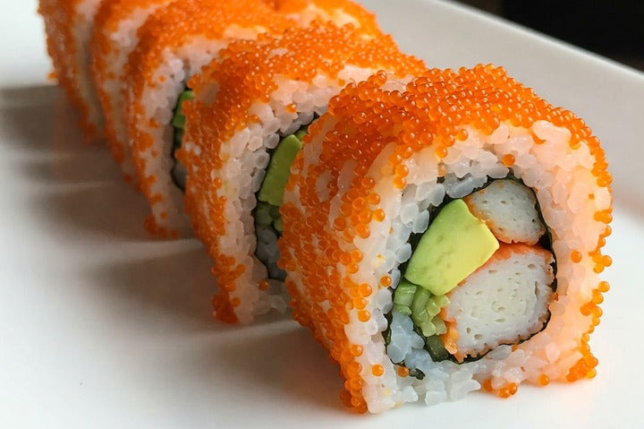 Tobiko California Rolls displayed on plate.