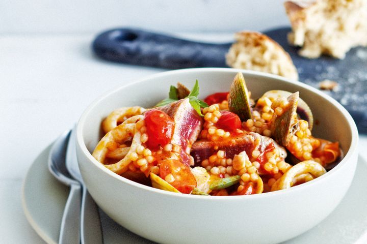 Tuna with Pearl Couscous in white bowl.