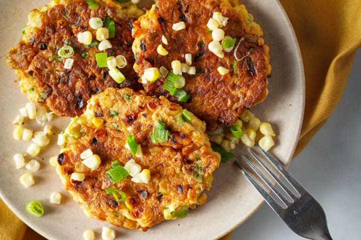 Whitebait Fritters displayed on a plate.