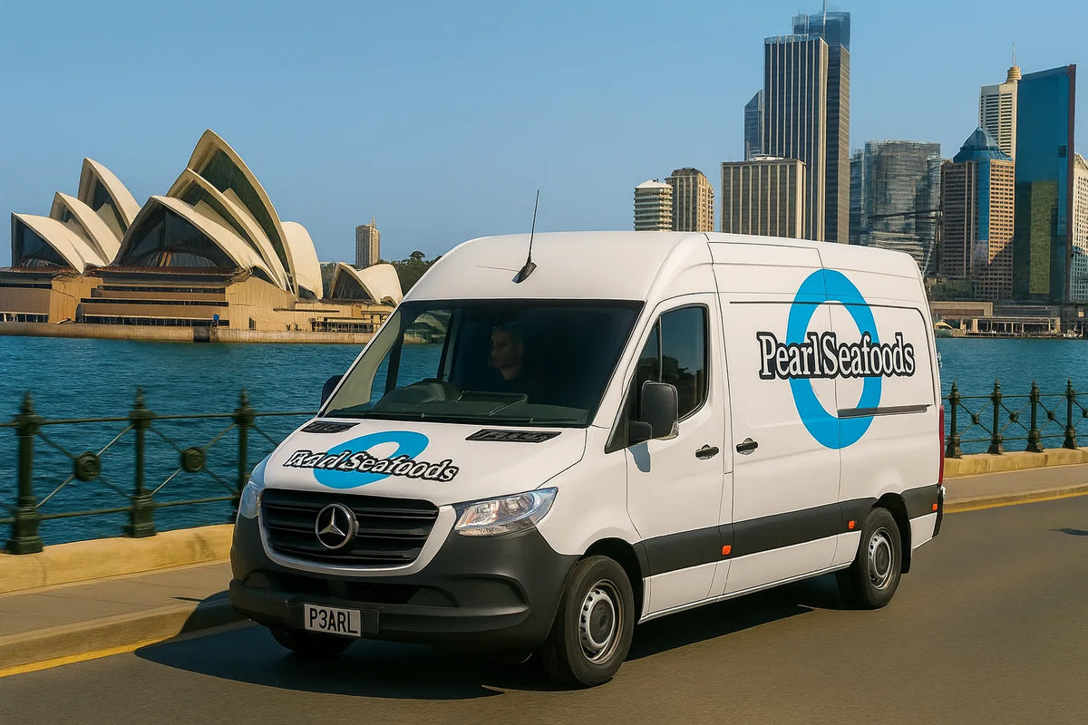White van with 'Pearl Seafoods' logo in front of the Sydney Opera House and city skyline.