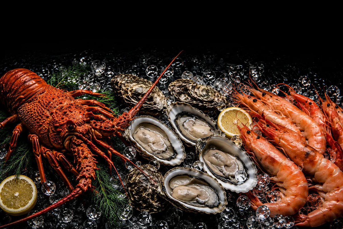 Seafood platter with lobster, prawns, and oysters on a dark background